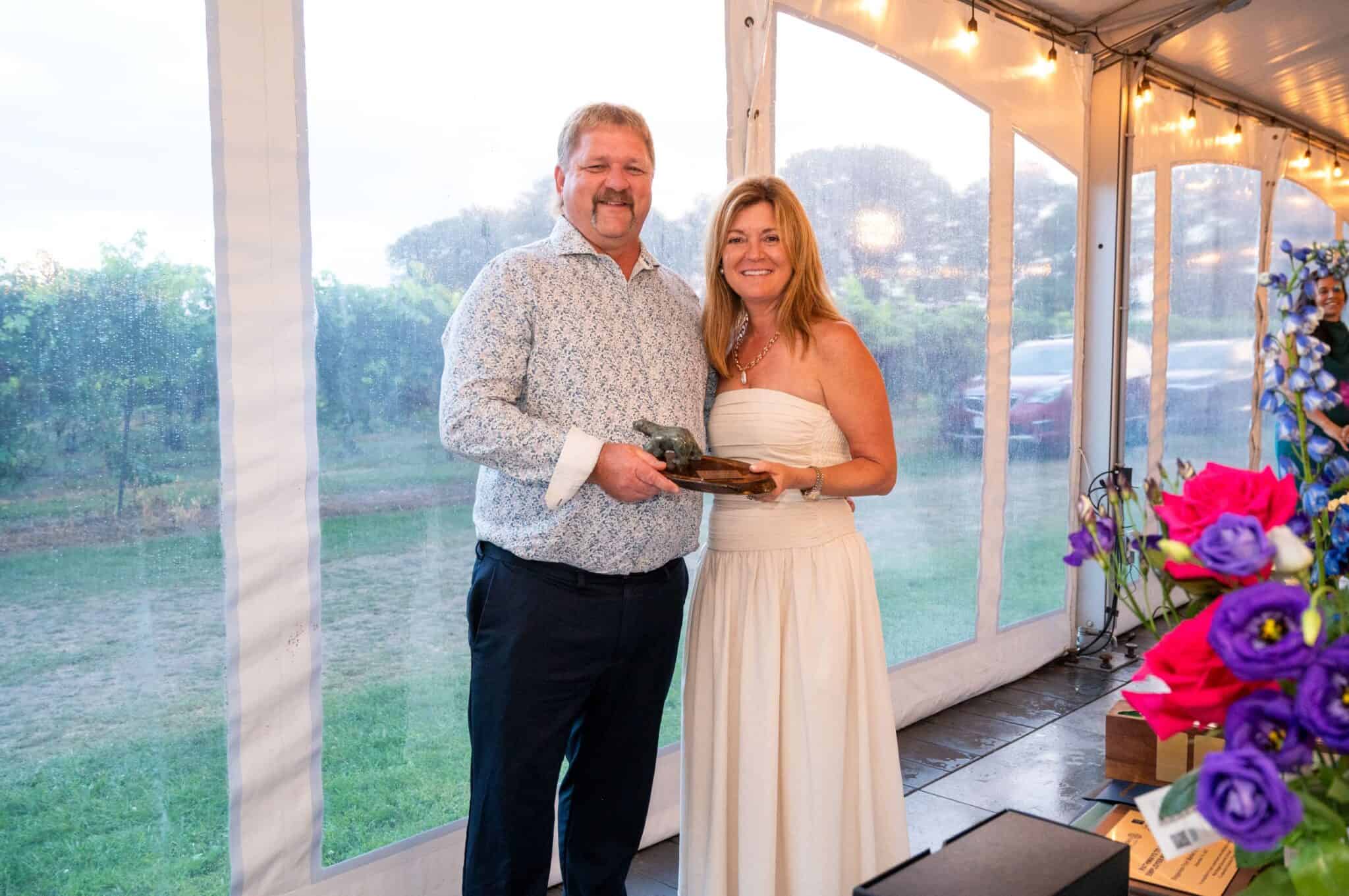 Alan smiling with the award presenter