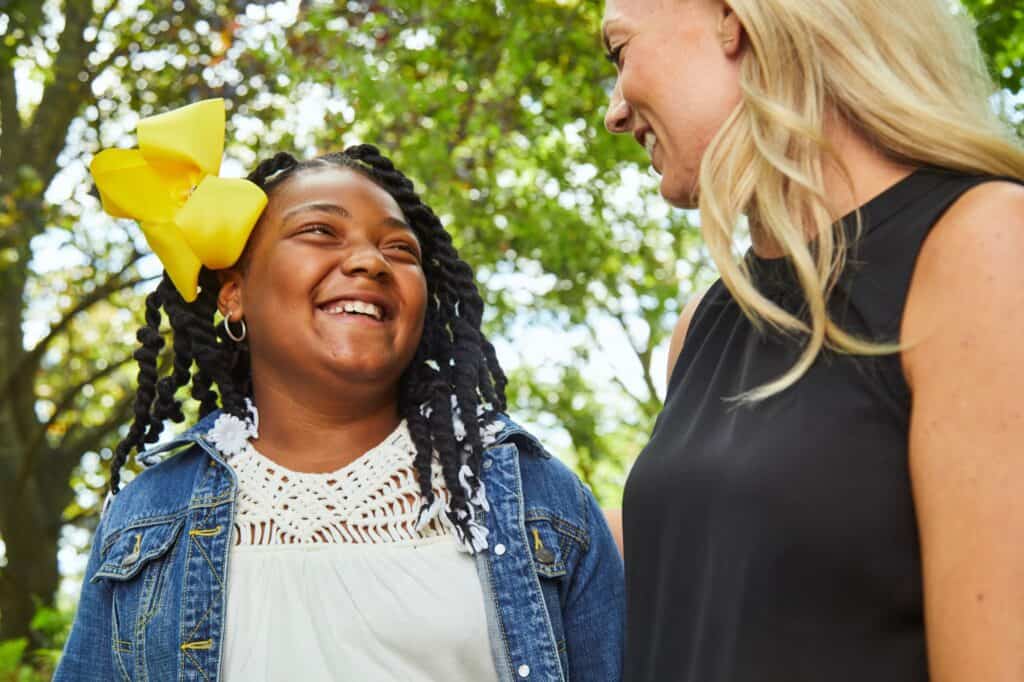 Young girl smiling at her mentor